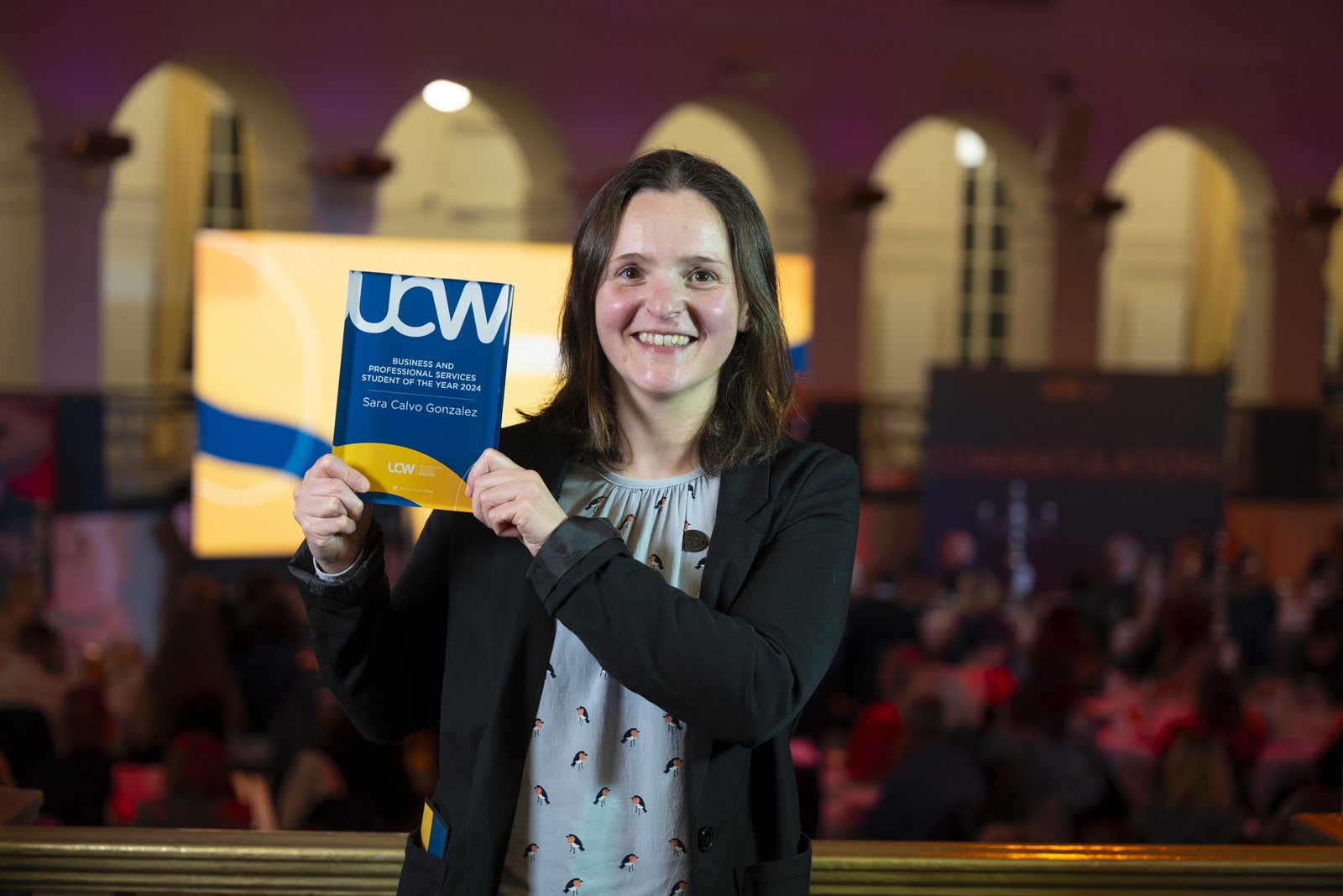 Sara showing her award from the UCW Awards