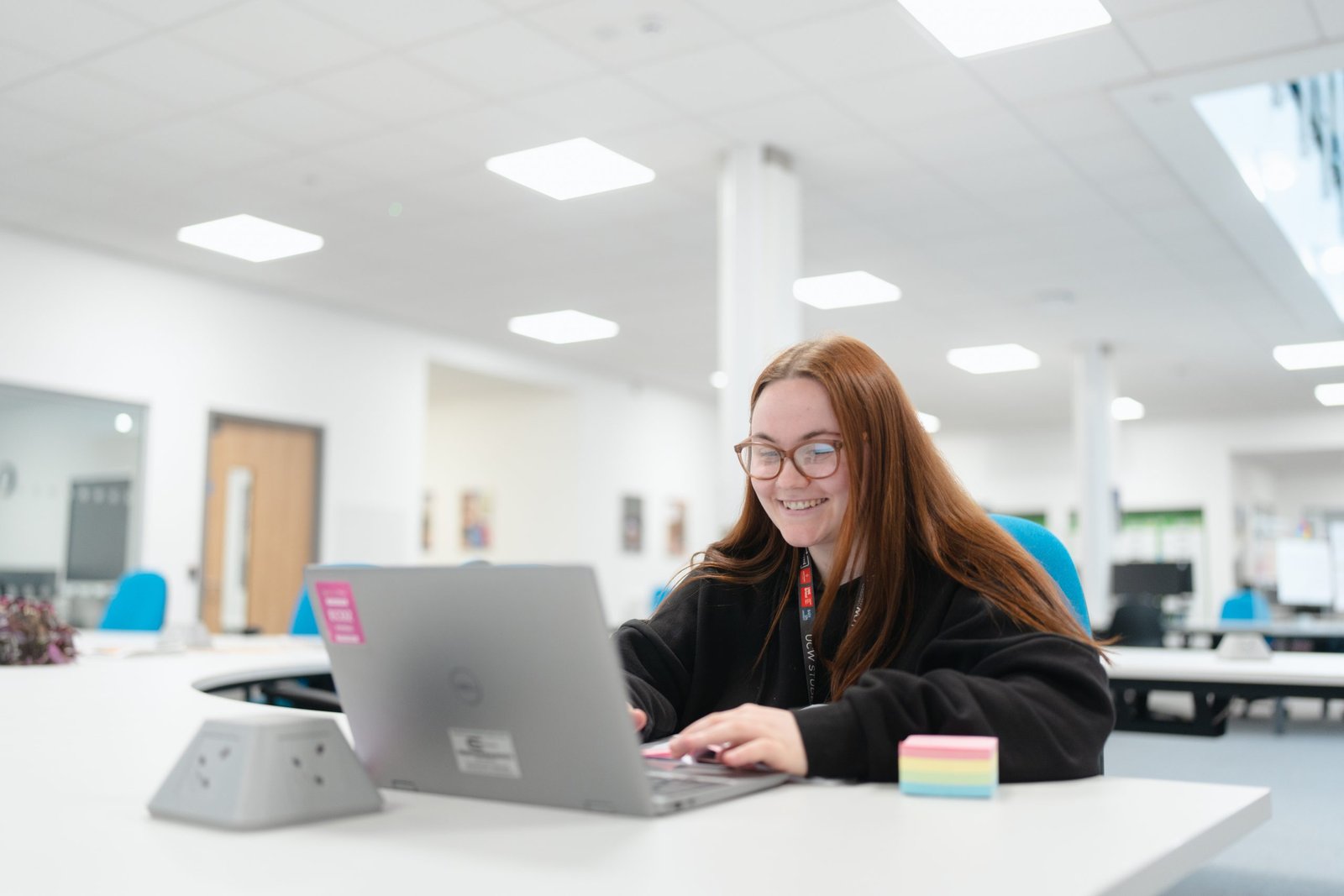 degree student using laptop at desk in weston-super-mare