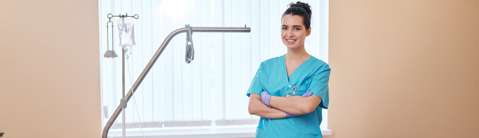 female nurse folding arms and smiling