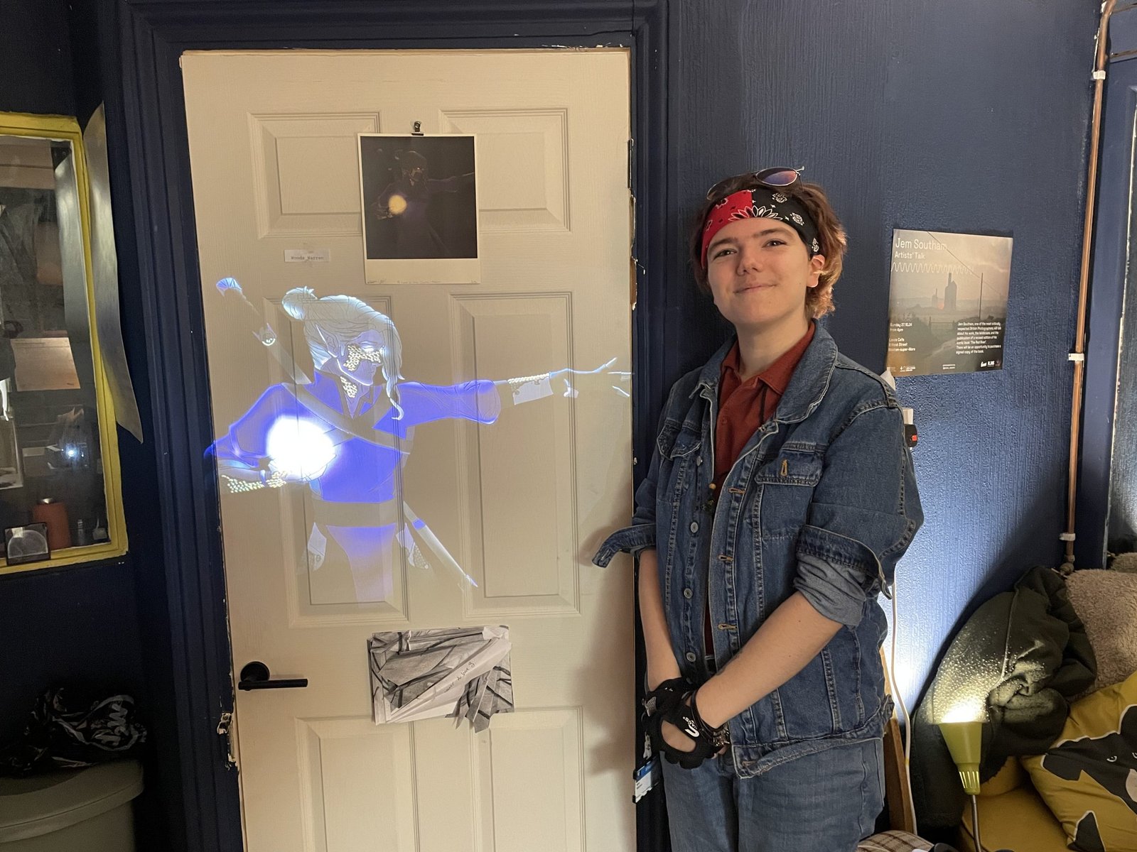 Woods standing next to their work at the exhibition