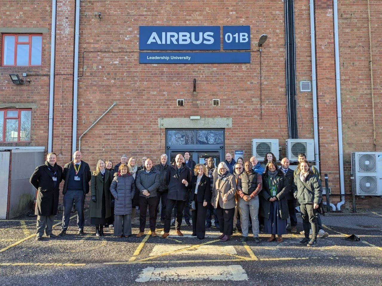 Weston College Group staff and Airbus staff standing together